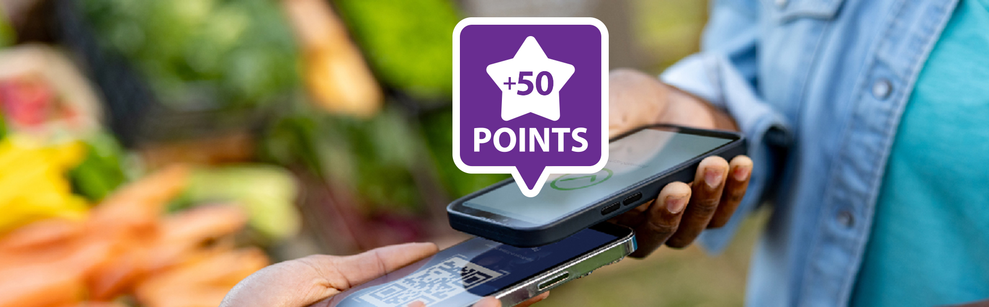 Two smartphones completing a contactless payment with a  50 Points rewards badge, illustrating rewards on everyday purchases through Value Rewards Checking.