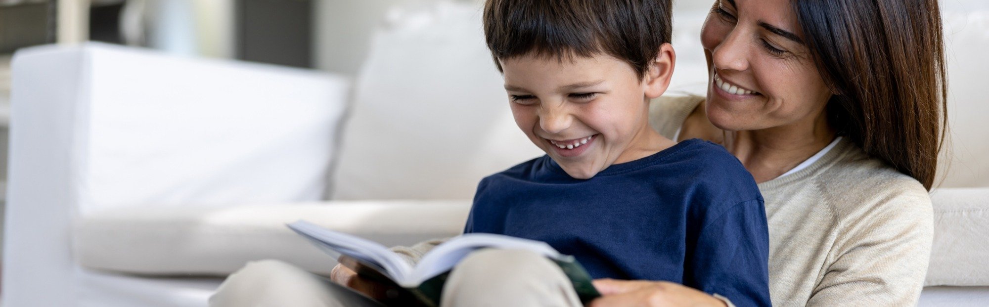 Hispanic mother and son reading