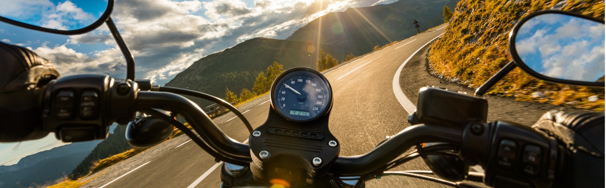 Riding a motorcycle on a mountain road