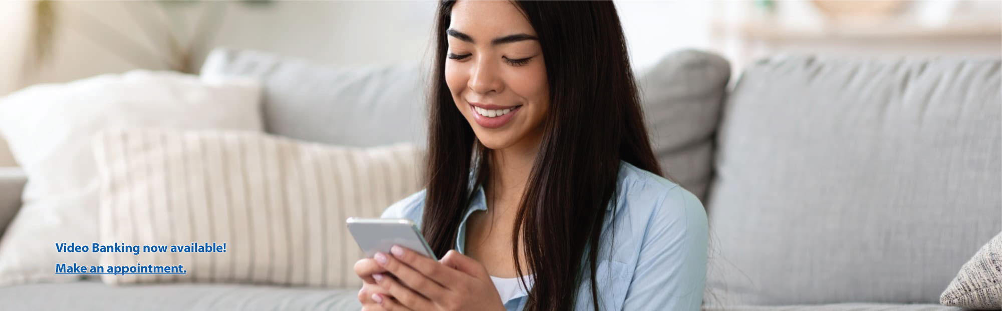 Smiling Couple Using Credit Card and Tablet