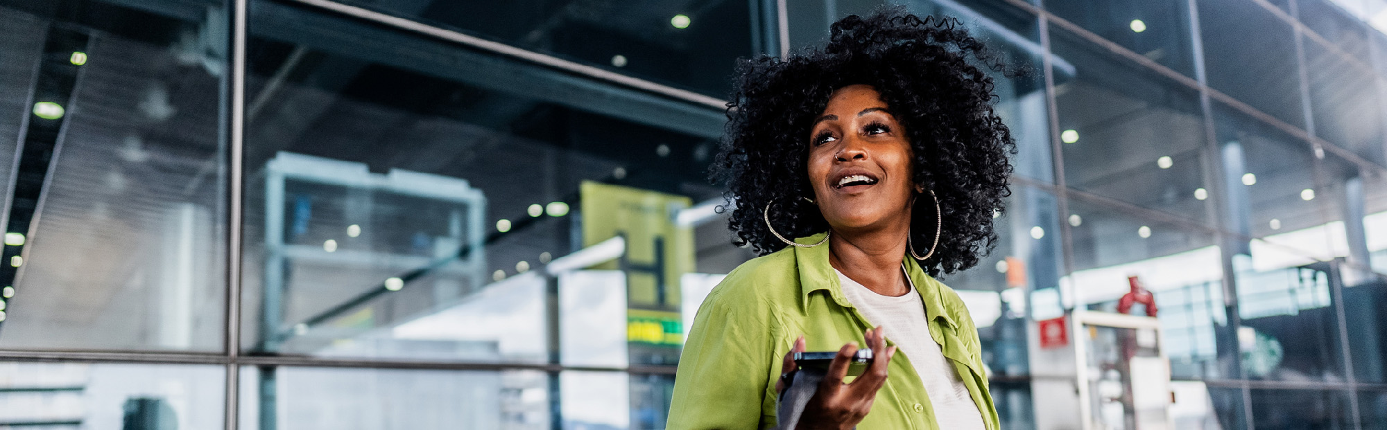 Woman Arriving at Airport and Smiling