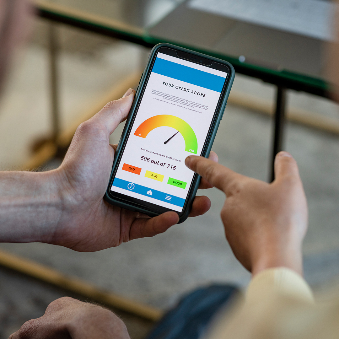 Person checking a credit score on a mobile phone.