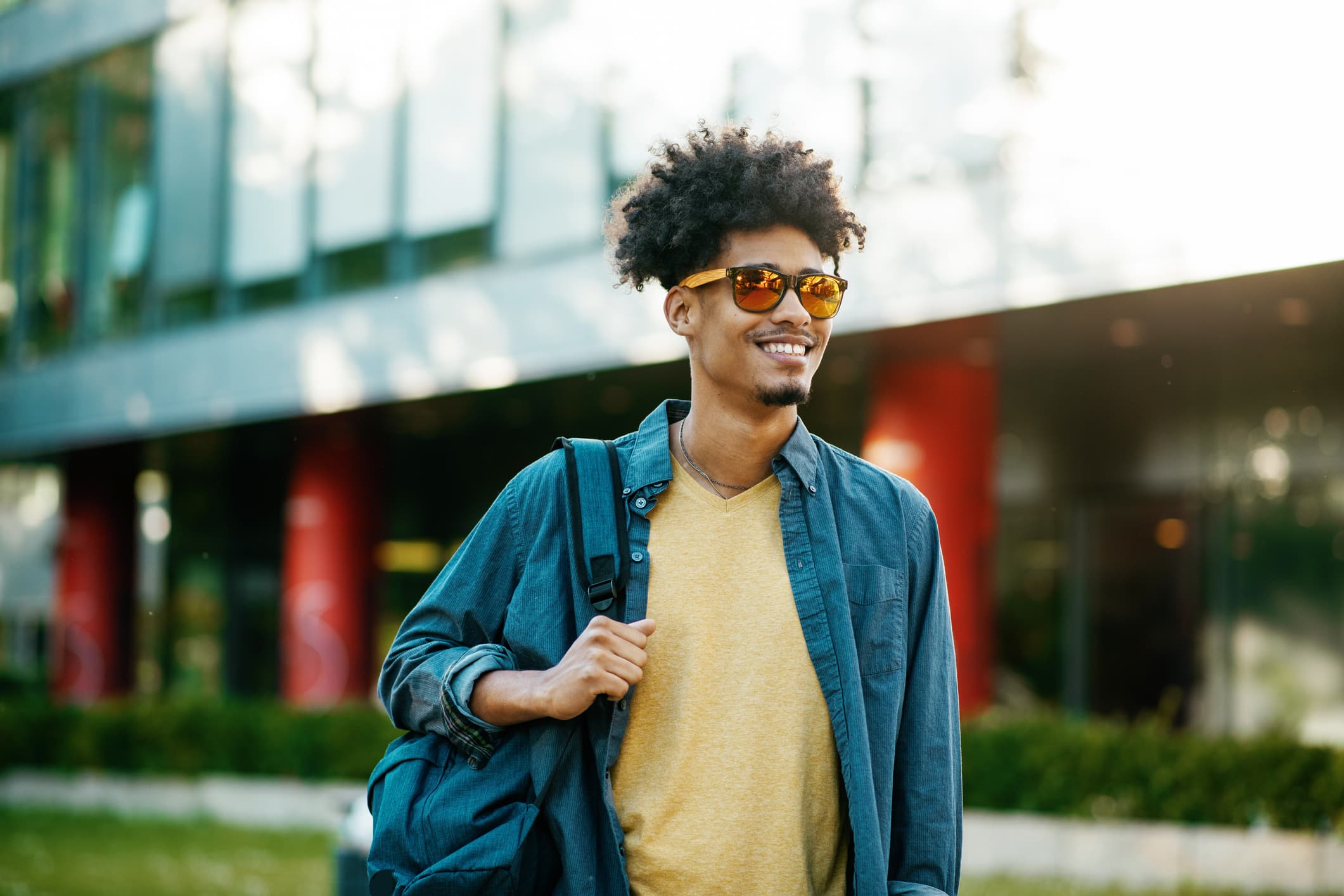 Stylish Guy in Sunglasses with Backpack
