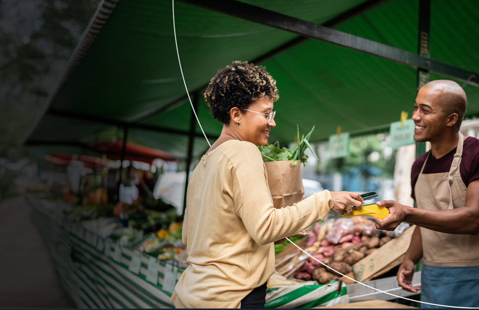 Woman Buying Flowers at Outdoor Shop