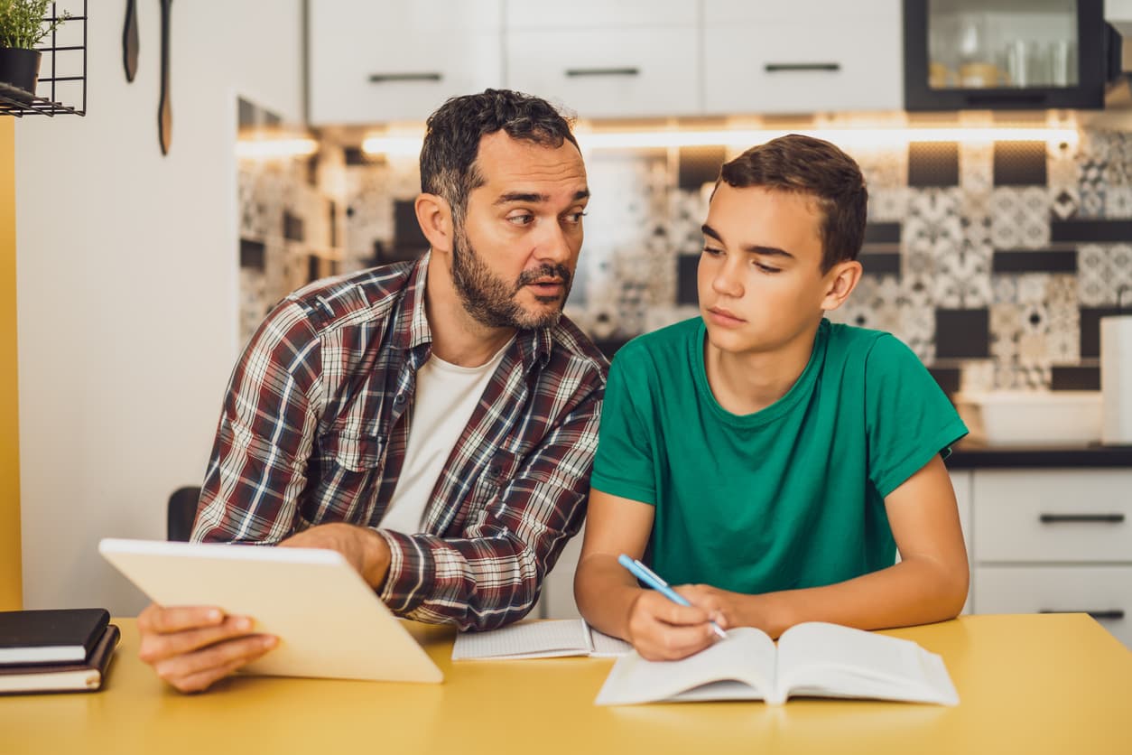 Fahter and Son Discussing Tablet and Notbeook