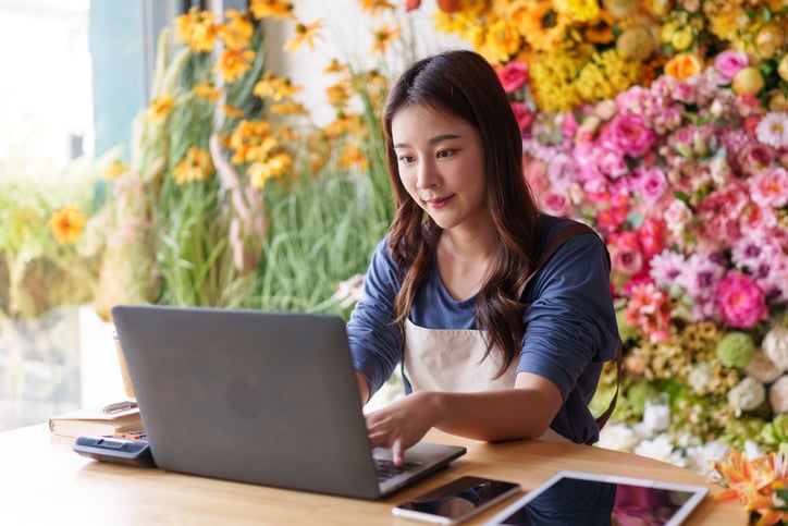 Girl in Flower Shop on Computer